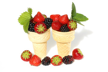 berry ice cream. summer dessert.ripe strawberries and blackberries in a waffle cup on a white background.berries season