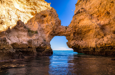 Fototapeta na wymiar Lagos Caves and Seashore with its Esmerald Water. Exposure done in a boat tour in the Lagos seashore, Algarve, Portugal