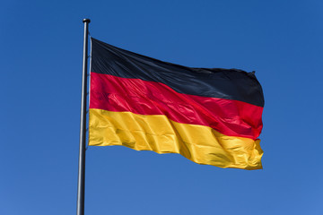 Germany: German national flag isolated on blue sky in the background