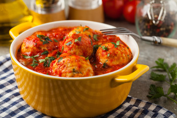 Chicken meatballs with tomato sauce. Served with rice.
