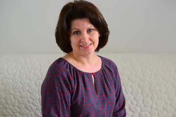 portrait of smiling middle-aged brunette woman