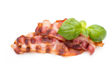 Cooked bacon rashers isolated on white.