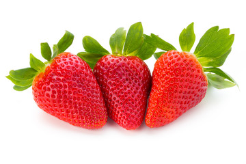 Fresh strawberries close up on white background.