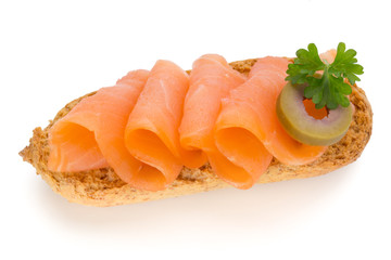 Bread with fresh salmon fillet isolated on white background, top view.