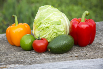 Fresh raw food on wooden table. Side view.