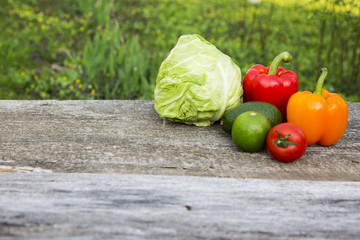 Fresh raw food on wooden table. Side view.
