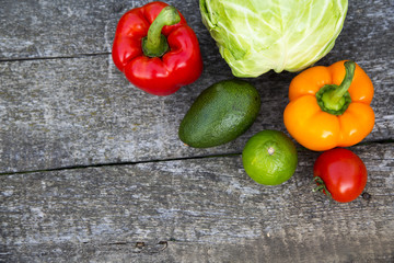 Fresh raw food on wooden table. Side view. Copy space.