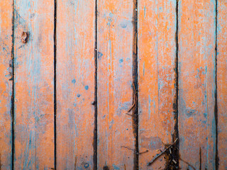 texture of an old wooden wall with old paint and rusty nails