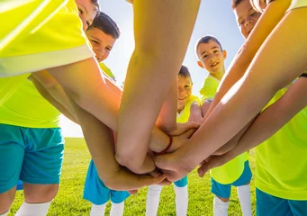 Zelfklevend Fotobehang Kids soccer football -  children in hudle © Dusan Kostic