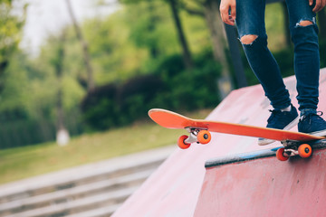Skateboarder sakteboarding on skatepark ramp