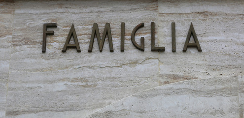 text FAMIGLIA that means famiyl in Italy Language