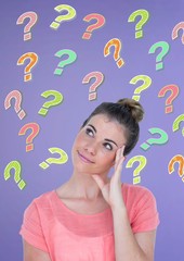 Woman thinking with colorful funky question marks
