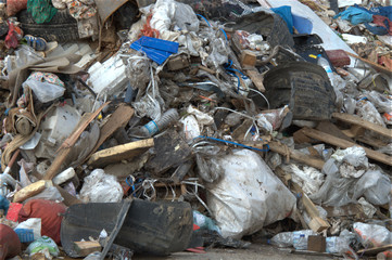 Heap of municipal garbage and trash at the side of the road, 