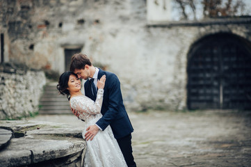 Sensual married couple, valentines hugging in front of old slavi