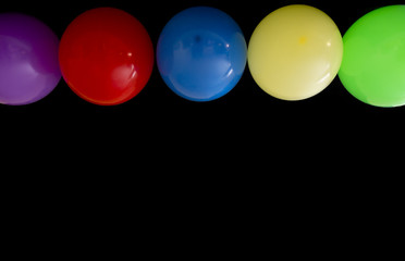 Colorful balloons on black background. 