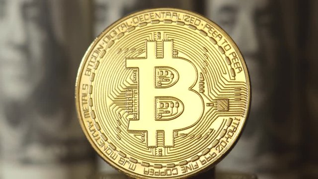 Crypto currency is bitcoin. BTK shoot close up. Bitcoin on dollars background. Blockchain technology