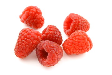 fresh red raspberry fruits isolated on a white background