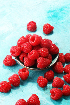raspberries. Raspberry on blue background. Summer and healthy food concept