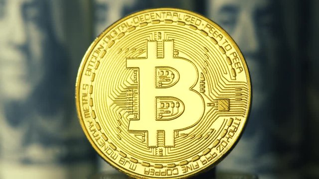 Crypto currency is bitcoin. BTK shoot close up. Bitcoin on dollars background. Blockchain technology