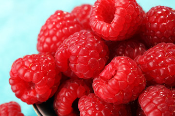 raspberries. Raspberry on blue background. Summer and healthy food concept