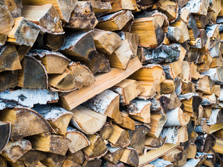 Stacked Logs Texture, Natural Background. Cross section of the timber, firewood stack for the background.