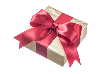 Present wrapped in glittery paper with red ribbon isolated on wh