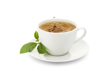 cup of tea with leaves and drop splashing, on white background