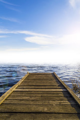 Fototapeta premium Fantastic view of the wooden pier in the lake. Scenery background
