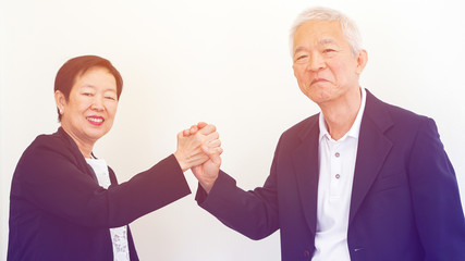Asian senior business people couple holding hand for successful life