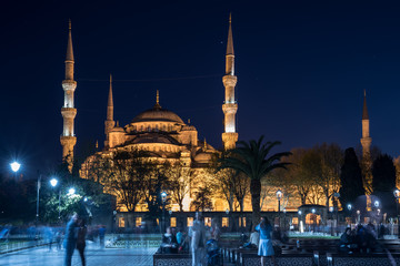 people sit in front of Sultanahmet Mosque