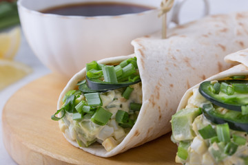 Egg salad and avocado wraps, Mexican style breakfast