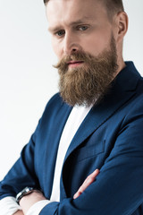 Stylish bearded man in blue jacket isolated on light background