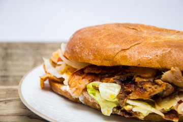 Turkish doner kebab on wooden table, fast food in Germany