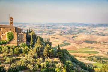 View of Montalcino, countryside landscape in the background, Tuscany, Italy - obrazy, fototapety, plakaty