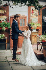 Groom with bride posing in wedding day