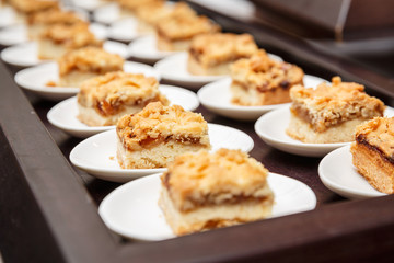 Set of small delicious apple cakes served in a  buffet for celebration
