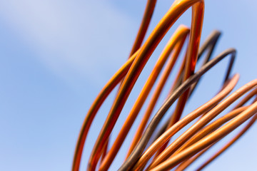 Copper wire against the blue sky