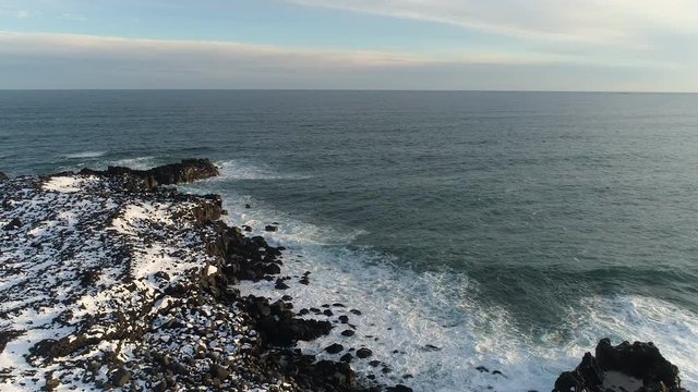 Waves splashing on the coastline in South Iceland