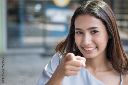 Happy Girl Pointing At You Portrait Of Cheerful Smiling