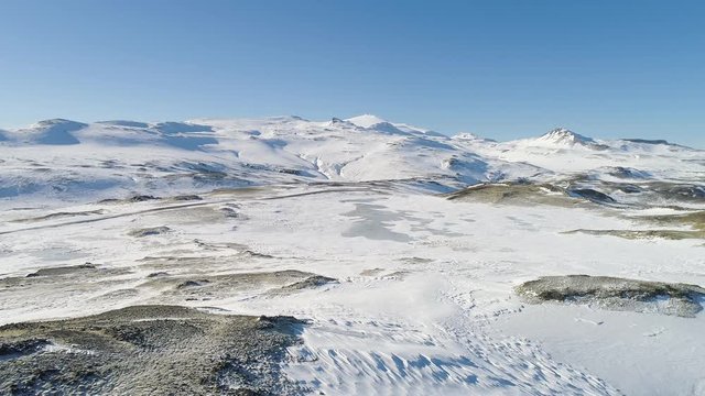 Flying sideways above winter landscape in east Iceland.