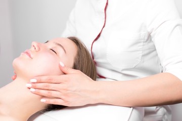 Fototapeta na wymiar Young girl on massaging procedure