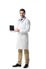 Doctor in glasses wearing white coat with stethoscope presenting digital tablet isolated on white