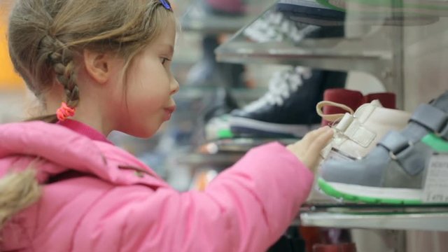 Little girl at shoe store