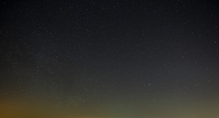 Fototapeta na wymiar Night sky with a bright star of the Milky Way. Panoramic view of the starry space.