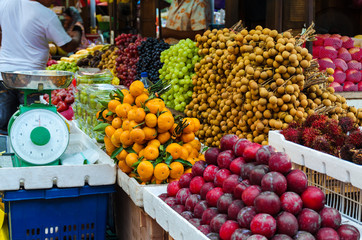 Fruit market at Kuala Lumpur street -  many different Asian organic fresh fruits. Photo with selective focus shot.
