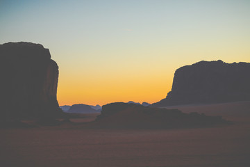 Wadi Rum in Jordan at sunset. Wadi Rum is known as The Valley of the Moon and has led to its designation as a UNESCO World Heritage Site.