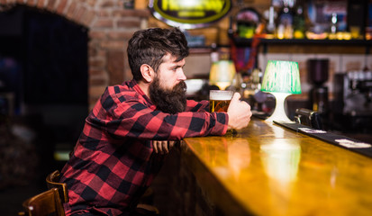 Guy spend leisure in bar, defocused background.