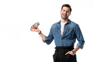 cheerful barman in apron with shaker in hand isolated on white
