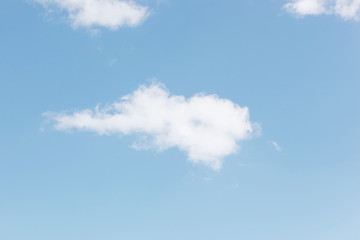 Fototapeta na wymiar Blue sky filled with fluffy white clouds