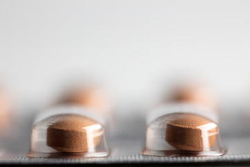 Blister pack of tablet on gray background, close up